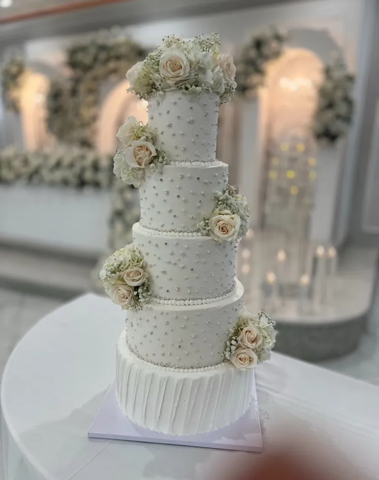 Pearl-embellished faux display cake by Aya's Sweets
